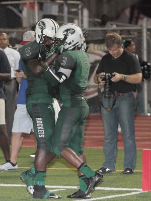 Central's Joseph Yearby (3) hugs junior receiver
Da'vante Phillips after scoring a touchdown on
Friday night. 