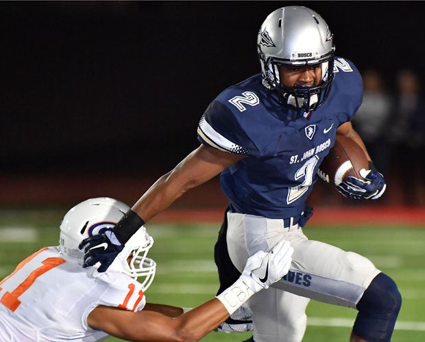 Bosco's Terrance Beasley (2) attempts to elude Gorman's Bubba Bolden.