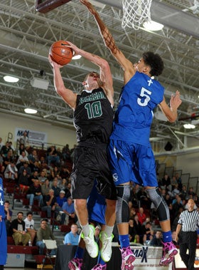 Tournament MVP Jason Todd goes to the rim against Michigan-bound D.J. Wilson of Capital Christian.