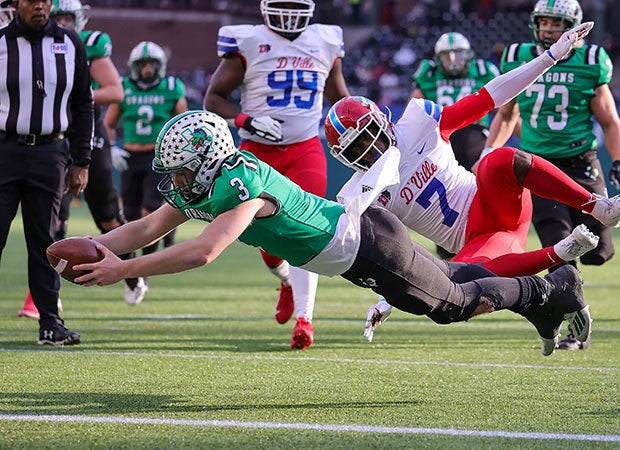 Southlake Carroll (Texas) quarterback Quinn Ewers dives for a touchdown during the UIL 6A Division 1 semifinal against Duncanville at Globe Life Park in Arlington.