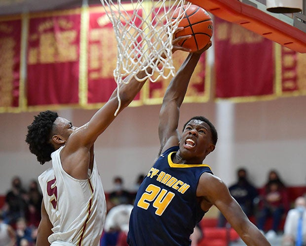 Damian Watson of Cypress Woods (Texas) blocks a dunk attempt by Cypress Ranch's Jaylen Benard. 