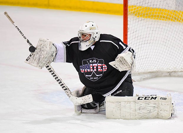 Goalie Brew Lewis of KJS United makes a stick save against Chatham during a varsity hockey game in New Jersey.
