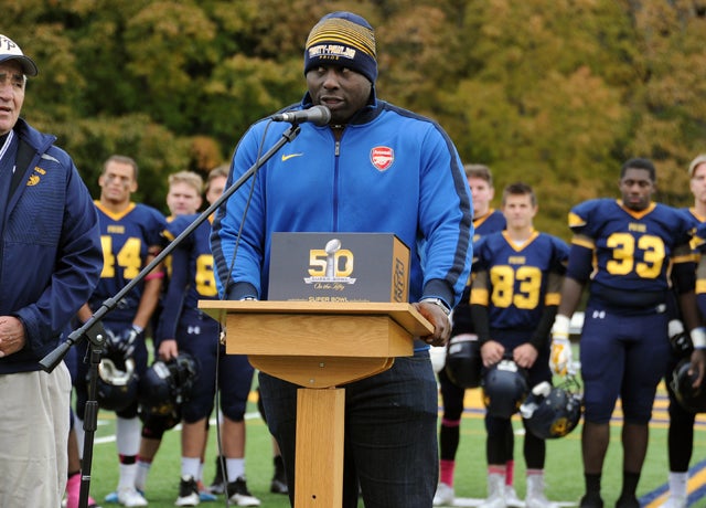 Trinity-Pawling graduate and Super Bowl champ Chukky Okobi addresses the crowd at halftime of T-P's game on Saturday against Hotchkiss.