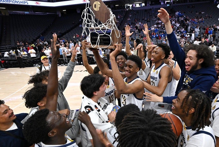 The Cornerstone Christian Cougars hoist the CIF Division III state championship trophy after a 74-64 victory over Birmingham Friday at Golden 1 Center. (PHOTO: David Steutel)