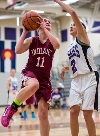 Cheyenne Mountain's Ashlynn Smith (11) scored 21
points in a first-round upset of Mead. The Class 5A
and 4A brackets produced eight upsets in Round 1.