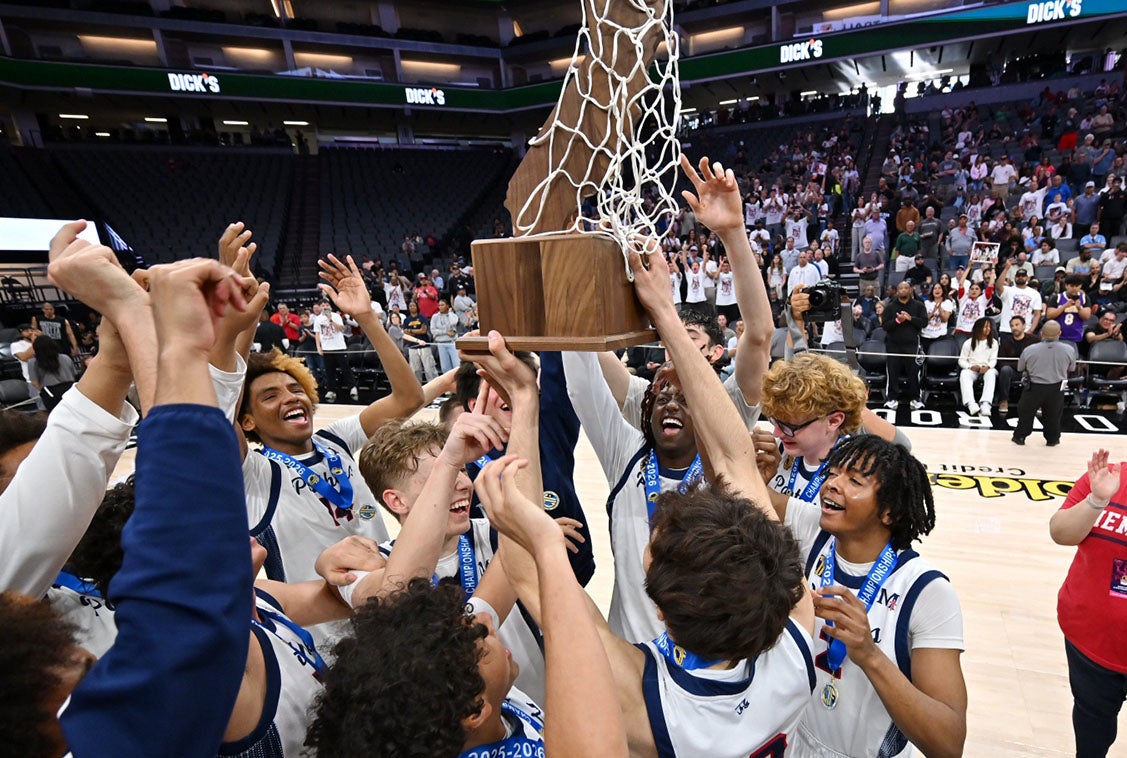 The San Joaquin Memorial Panthers hoist the CIF Division II state championship trophy after surviving a 46-45 win over Central Section rival Bakersfield Christian Saturday at Golden 1 Center. (PHOTO: David Steutel)