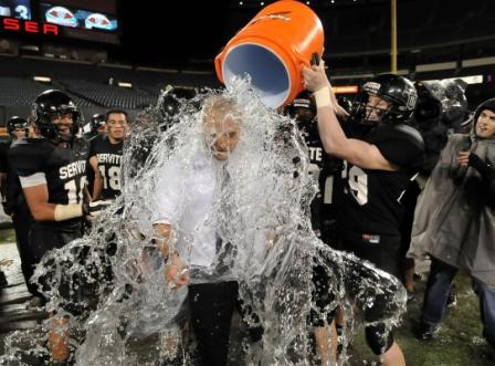 Servite players dump on head coach Troy Taylor after knocking off Edison in the Pac-5 final.