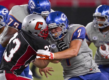 Powell's day was made easier by vicious blocking like this from fullback Mark Philippi (7) and Ronnie Stanley.