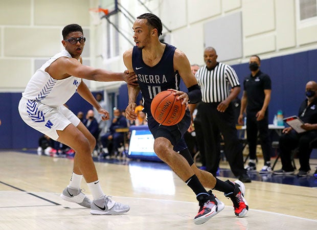 Amari Bailey drives to the basket during his 35-point performance against Windward.