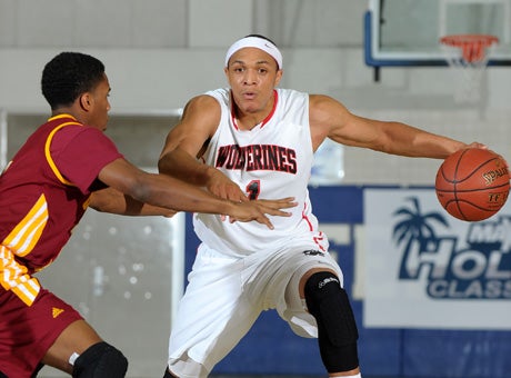 Harvard-Westlake junior Derick Newton hit two free throws with 3.5 seconds left to lift his team to a thrilling 71-69 win over Cardinal Hayes in first-round play of the MaxPreps Holiday Classic's premier Invitational Division.
