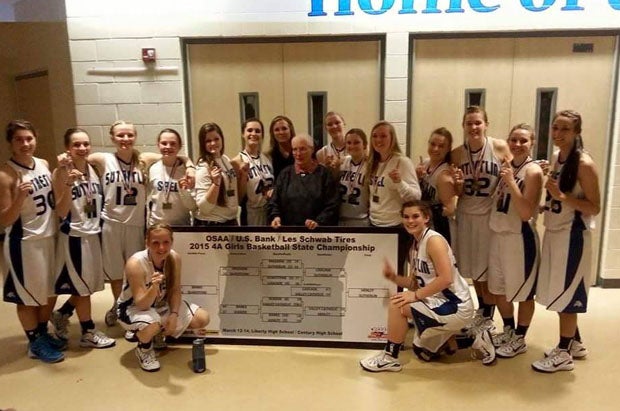 The 2015 team posing after winning the state championship.