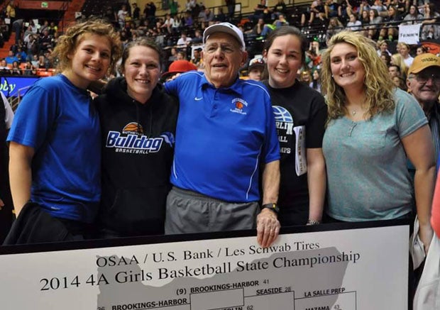 Fans and players joined in the celebration with Bill Spelgatti after Sutherlin won the 2014 state championship.
