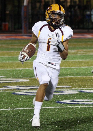 Mountain Pointe senior Paul Lucas returns
a kickoff 83 yards for a touchdown in the 
third quarter of his team's 66-13 win.