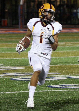Mountain Pointe senior Paul Lucas returns
a kickoff 83 yards for a touchdown in the
third quarter of his team's 66-13 win.