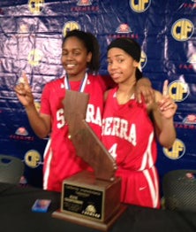 Serra state champions Siera Thompson
(l) and Deandrea Toler.