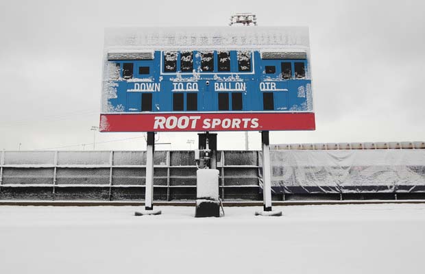 The scoreboard is covered in snow at All City Stadium.