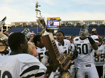 Good Counsel players celebrate their school's first-ever undefeated season.