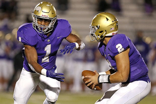 Dallas Hayden (1) prepares to take a hand-off from Christian Brothers quarterback Ashton Strothers during a game in October.