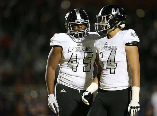 Desert Pines linemen Braezhon Ross and Gabriel Lopez