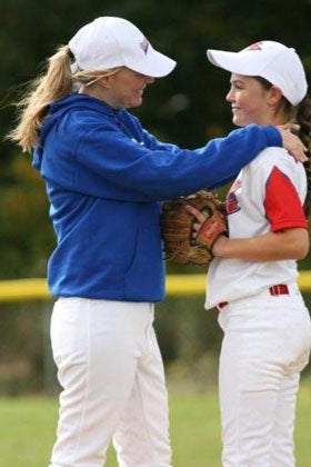 Justine Siegal counsels Chelsea Baker on the mound.