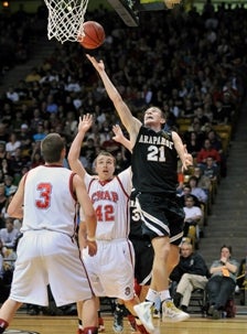 Arapahoe's Zach Kocur (21) rebounds
against Chaparral.