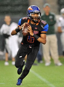 Westlake quarterback Justin Moore 
led his team in rushing and passing.