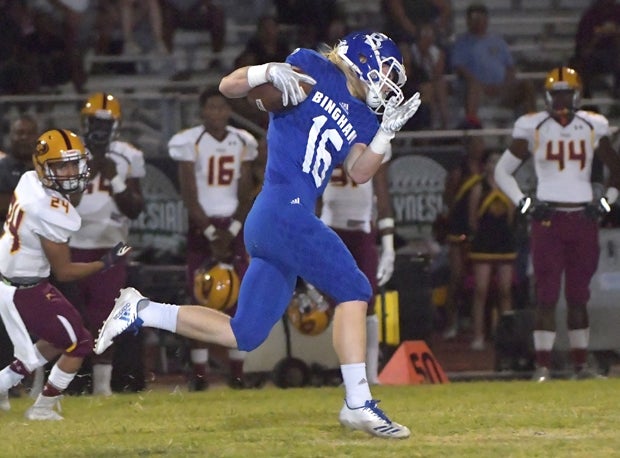 Bingham's Aiden Larsen returning one of his two interceptions. 