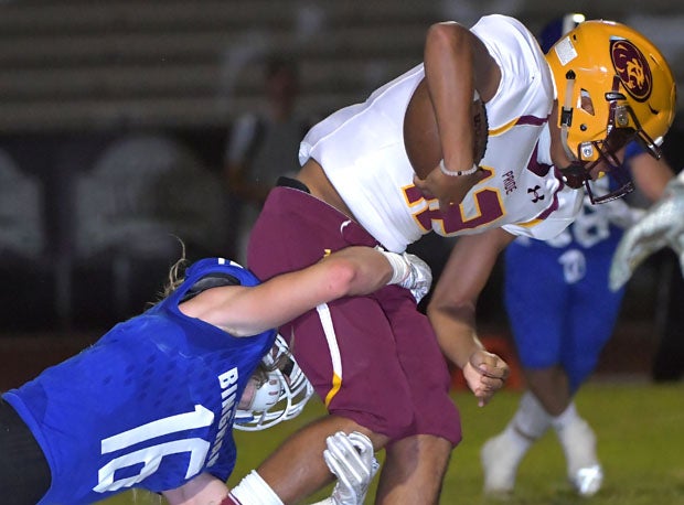 Binham's Aiden Larson (16) takes down Mountain Point's Eli Sanders.