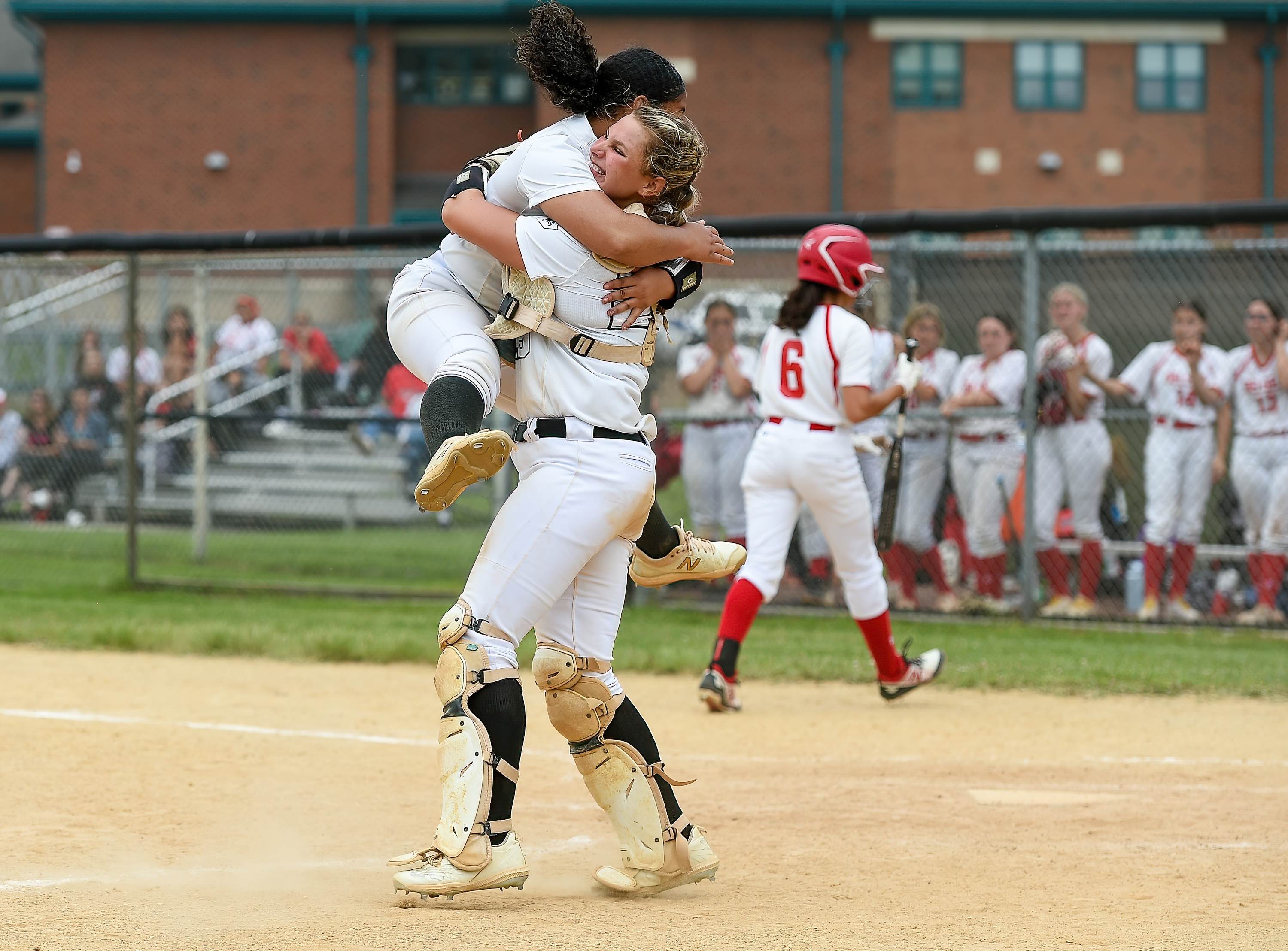 Burlington Township pitcher Rylee Reed and catcher Taylor Fitzpatrick celebrate the school's first South Jersey Group 3 championship on May 26.