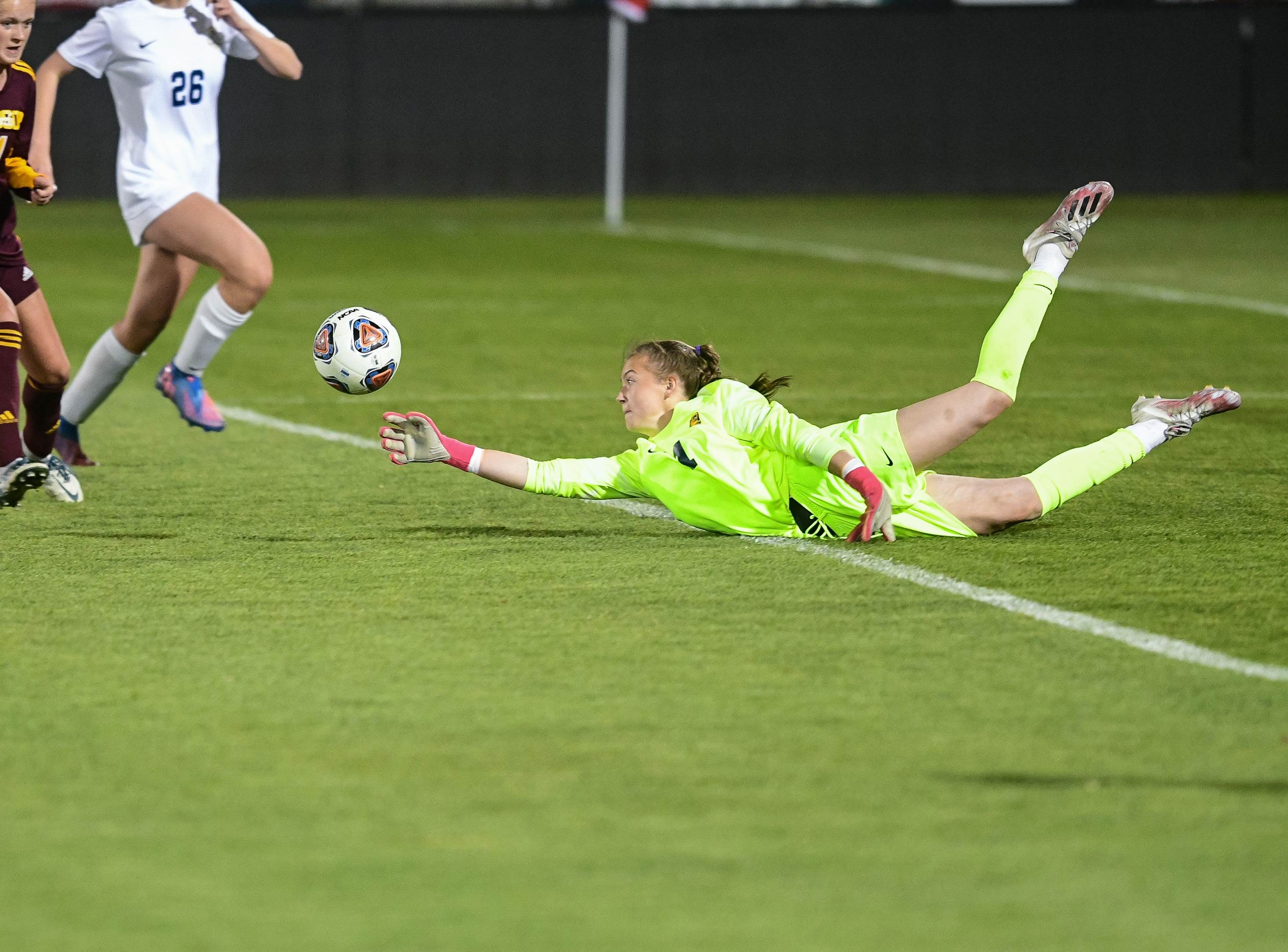 Northfield goalie Chloe Rhodes makes a diving save in overtime to preserve a scoreless tie with Windsor. Rhodes was the star for Northfield as she stopped two penalty kicks to give her team the CHSAA 4A title.