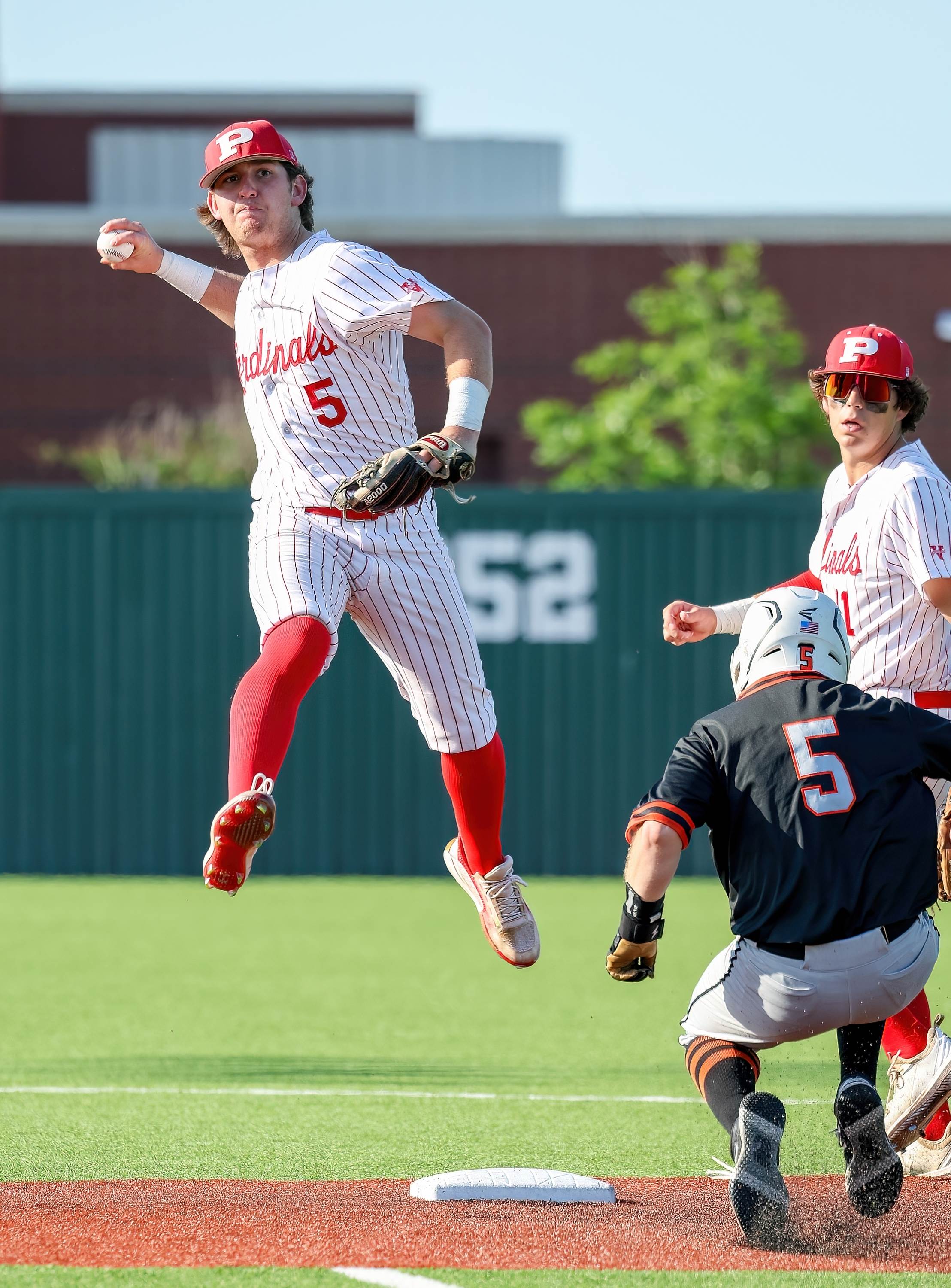 Pottsboro's Grayson Watson looks to turn two against Grand Saline in the Cardinals' 4-0 area playoff win on May 6.
