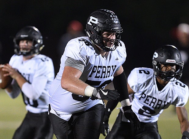 Perry - led by senior lineman and Michigan State commit Matt Carrick (No. 56) - faces LaSalle in a rematch of last year's Division II state final.