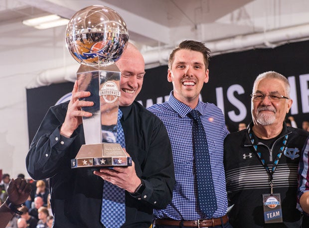 Central Valley coach Freddie Rehkow holds up the trophy.