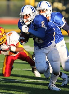 Eric Redwood had four TDs and game-
winning two point conversion last
week against Buhach Colony. 