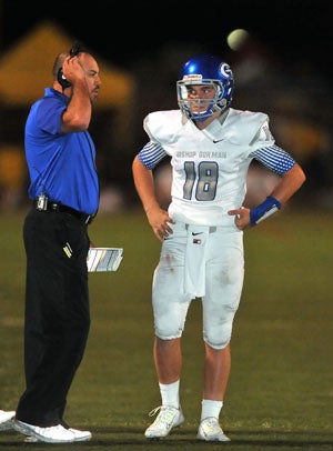 Tate Martell with coach Tony Sanchez.