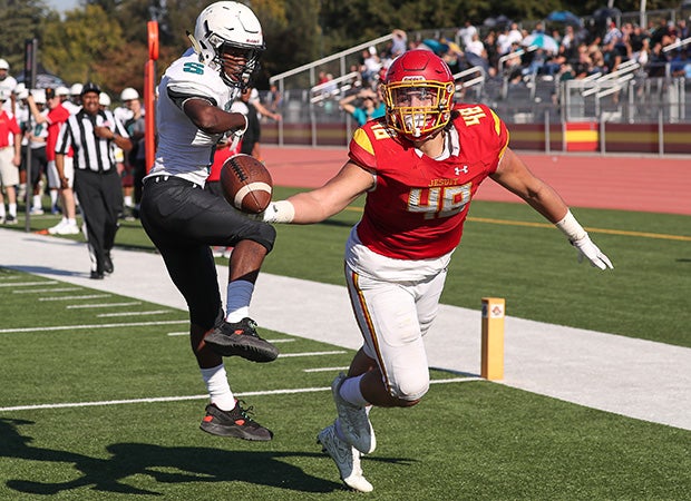 Tight end Laiatu Latu of Jesuit (Calif.) attempts a fingertip catch in the end zone
