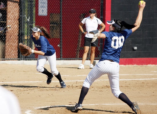 Mullen's Gia Marquez (00) delivers a pitch at Eaglecrest on Saturday.