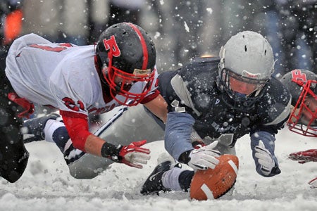 On Long Island, Plainedge and Hewlett played through the snow Saturday.
