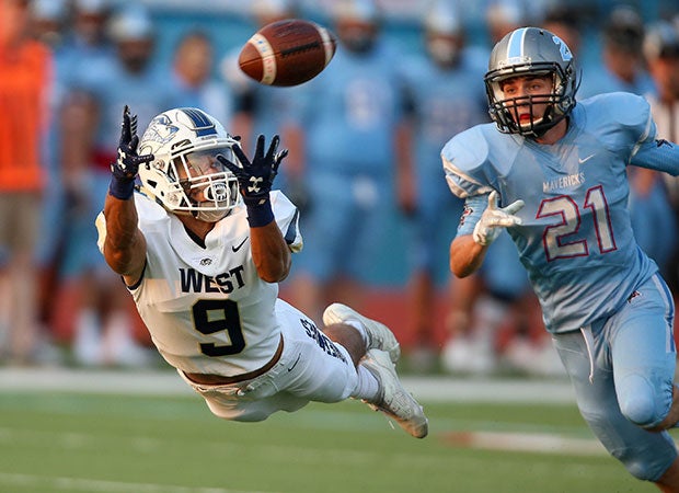 Brandon Humes of Bentonville West (Ark.) lays out for a diving catch against Southside.