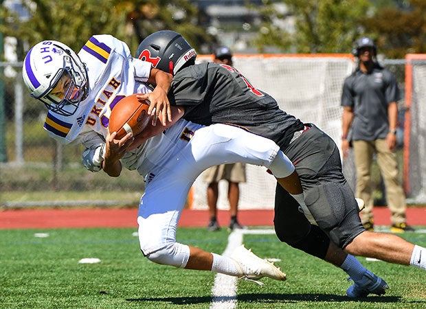 Redwood (Calif.) linebacker Harry Minturn stuffs a Ukiah quarterback.