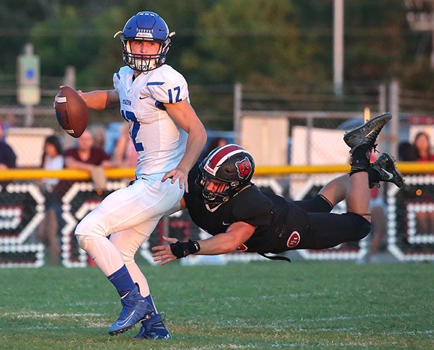 Linebacker Parker Garrison of Bunker Hill (N.C.) makes a diving sack on Maiden quarterback Ethan Rhodes