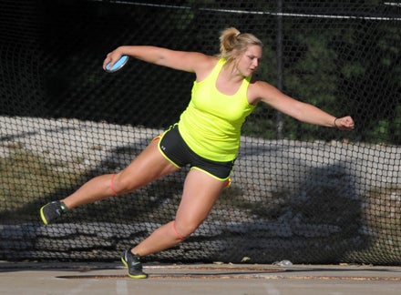 Shelbi Vaughan twice bettered her 6-day-old national high school record in the discus on Friday at Indiana University. She beat her previous record by almost five feet at 198-9. She also beat the meet record by two inches.