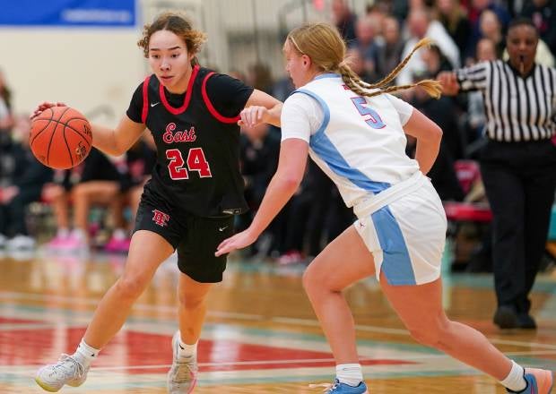 Wauwatosa East senior Mikaia Litza, a DePaul signee, is averaging 17.6 points per game for the 20-0 Red Raiders, riding a 32-game winning streak. (PHOTO: David Feyen)
