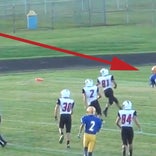 Video: Pass goes off helmet for a touchdown in what may be the junior varsity football catch of the year