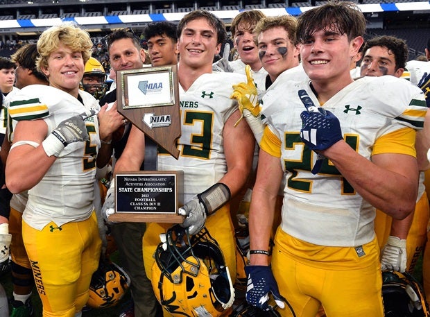 Bishop Manogue players celebrate their Nevada Class 5A II title victory in November. (Photo: Jules Karney)