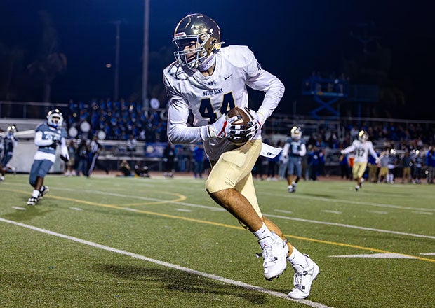 Tyran Stokes makes his way to the end zone during his high school football debut Friday night. (PHOTO: Greg Fiore)