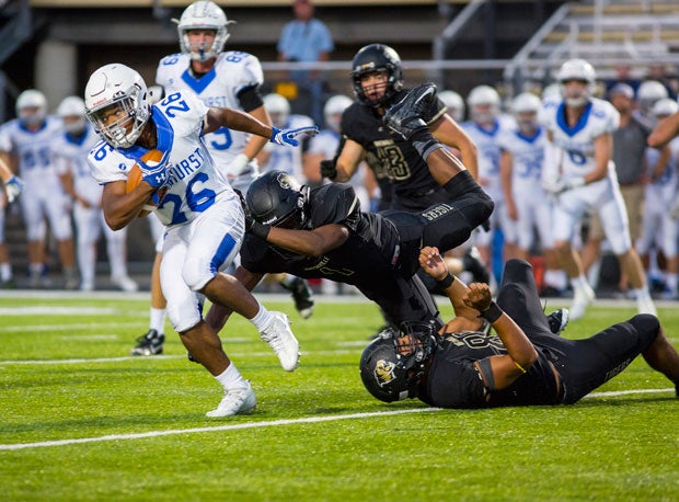 Rockhurst's Tyrell Lyons runs against Bentonville. The Hawklets drop to No. 24, down from No. 20, in this week's midwest rankings.