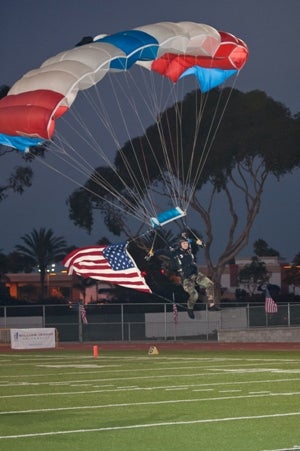 A paratrooper enters the Oceanside High field Friday.