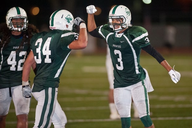 Jace Whittaker (right) and Josh Bernard celebrate Friday for Oceanside.
