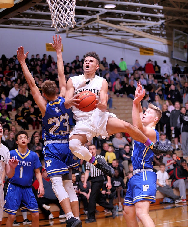 Lincoln Southeast (Neb.) guard Brayden Day soars down the lane for a layup against North Platte.